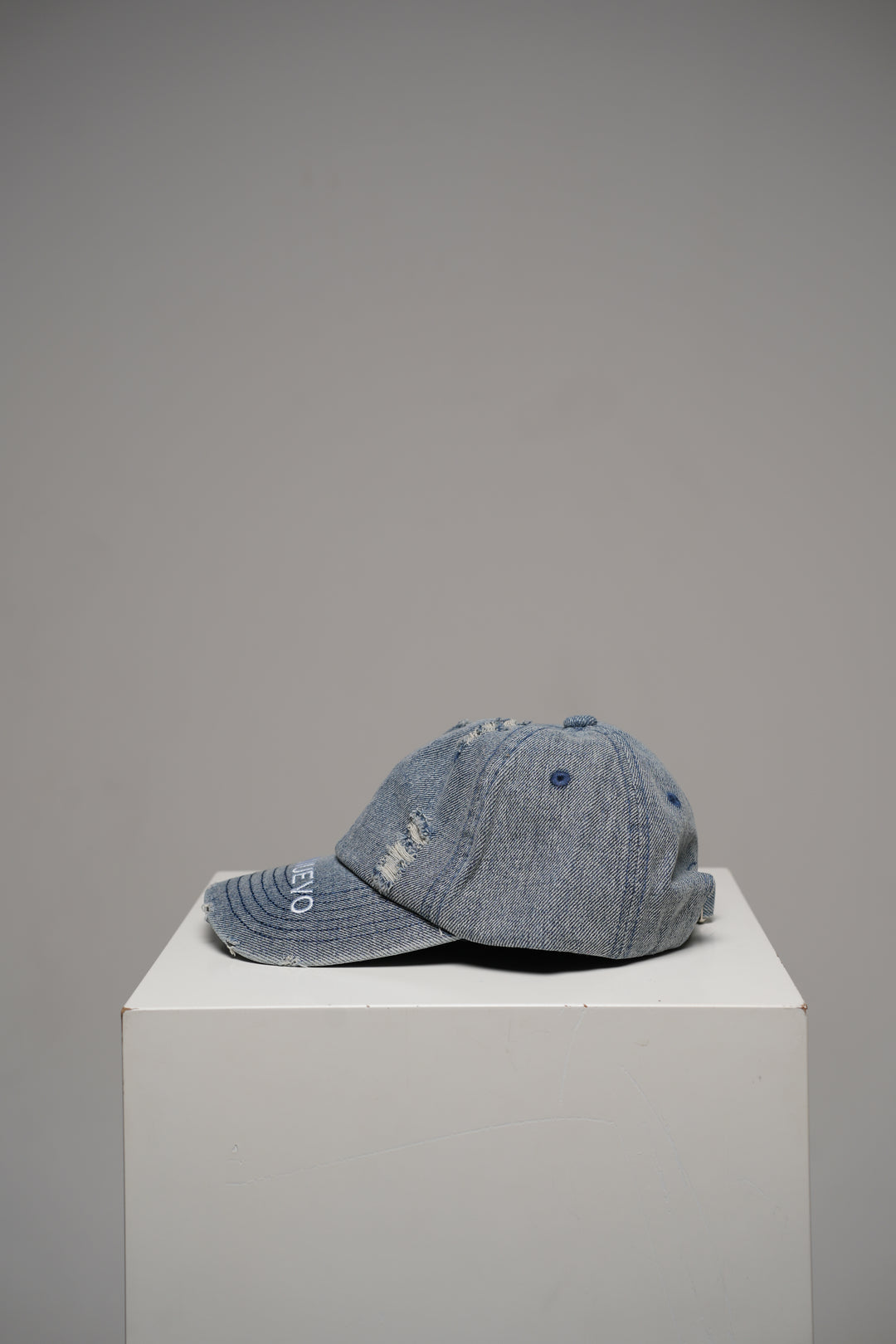 Distressed denim cap